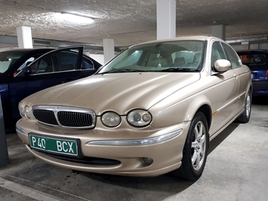 Jaguar X Type with green import plates
